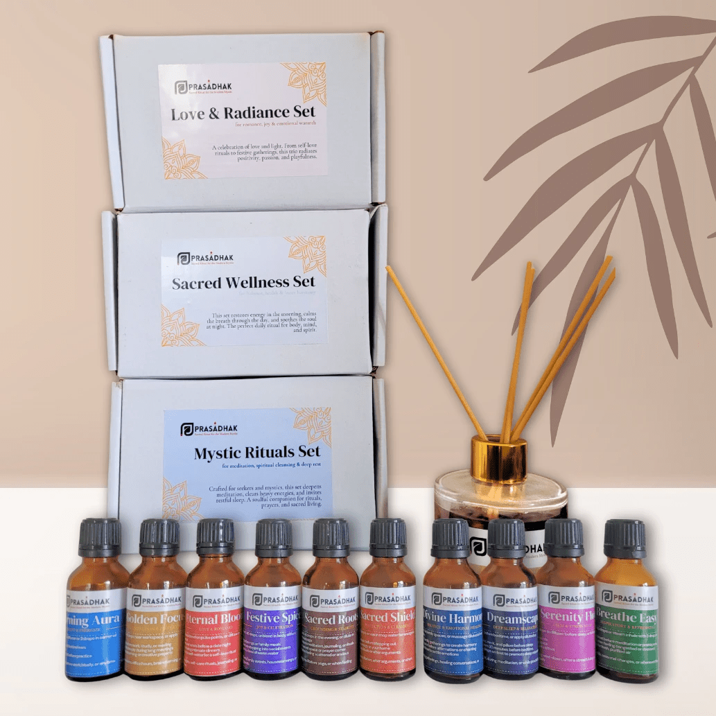 Prasadhak Love & Radiance Set flat-lay with essential oil bottles, sage smudge stick and affirmation cards