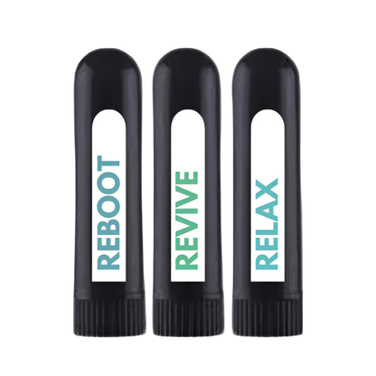 Three black nasal inhalers with different words printed on them. The first one says 'REBOOT', the second one says 'RELAX', and the third one says 'RX'.
