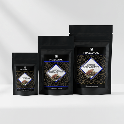 Three stand-up pouches of Prasadhak Unrefined Cocoa Butter in different sizes, arranged in a row against a clean white background with soft shadows.
