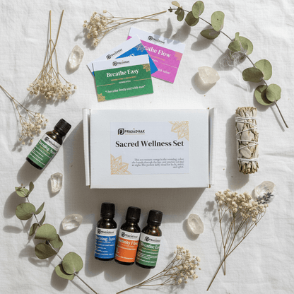 Full Sacred Wellness set flat lay on white linen with affirmation cards, sage stick, and essential oil blends