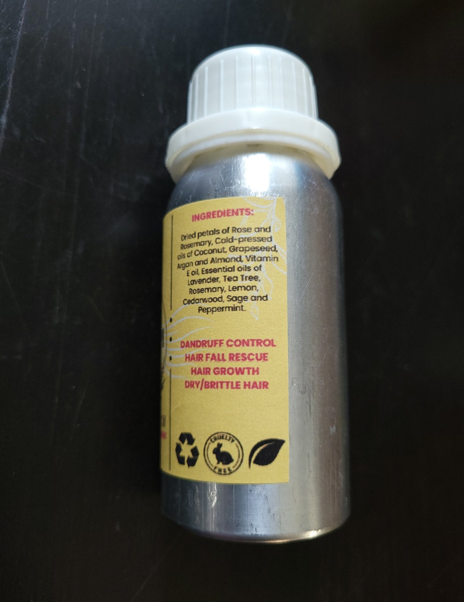 Prasadhak Champi Hair Oil bottle - Ayurvedic scalp massage oil with rose, rosemary, argan, and almond.