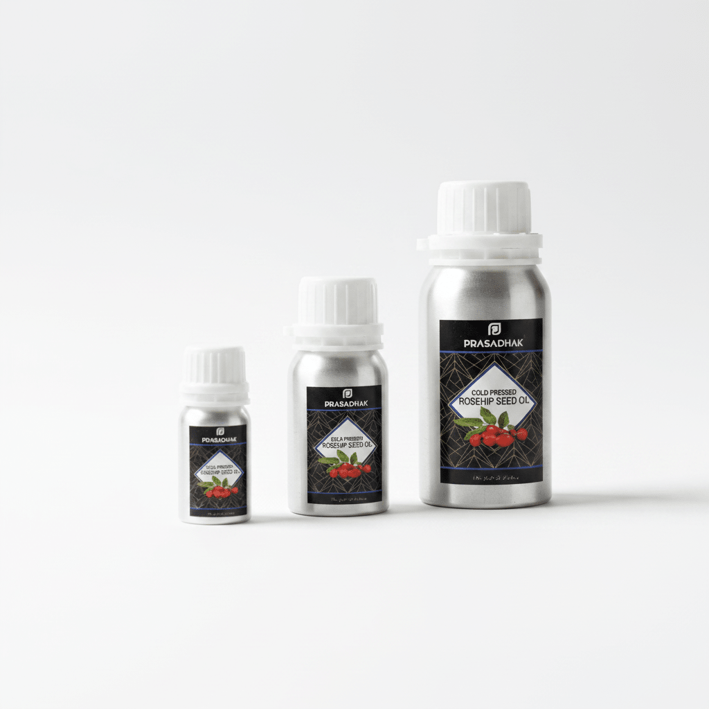 Three silver metal bottles of Prasadhak Cold pressed Rosehip Seed Oil in different sizes, arranged from smallest to tallest on a clean white background.