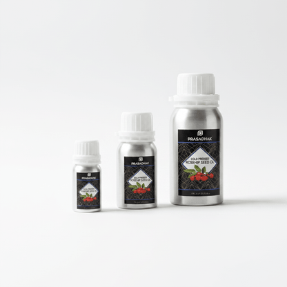 Three silver metal bottles of Prasadhak Cold pressed Rosehip Seed Oil in different sizes, arranged from smallest to tallest on a clean white background.