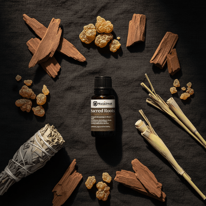 Prasadhak Sacred Roots essential oil centered on a dark textured background